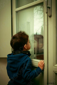 boy-looking-through-window-on-1570574.jpg