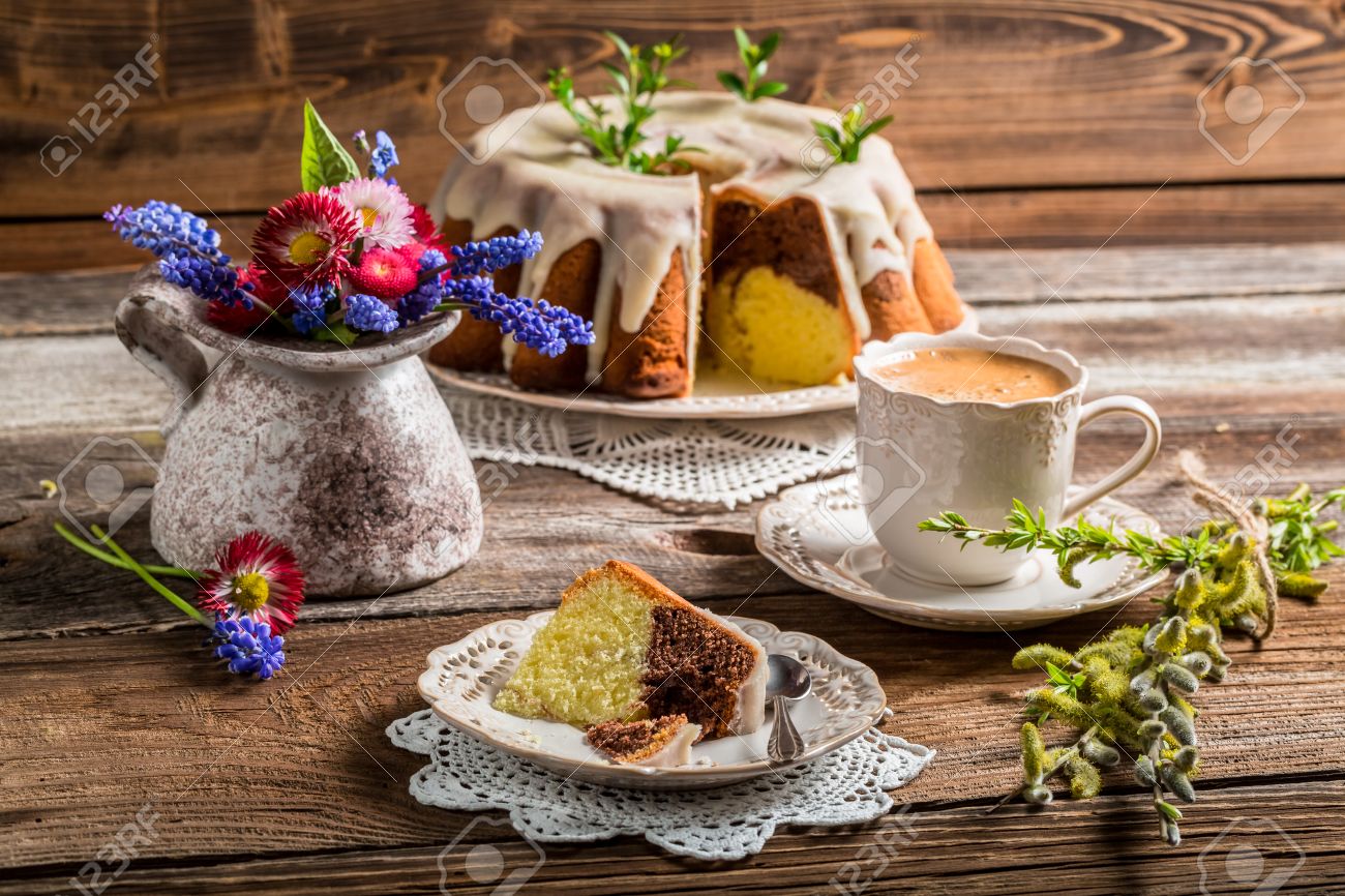 28651391-Easter-cake-cup-of-coffee-and-spring-flowers-Stock-Photo.jpg